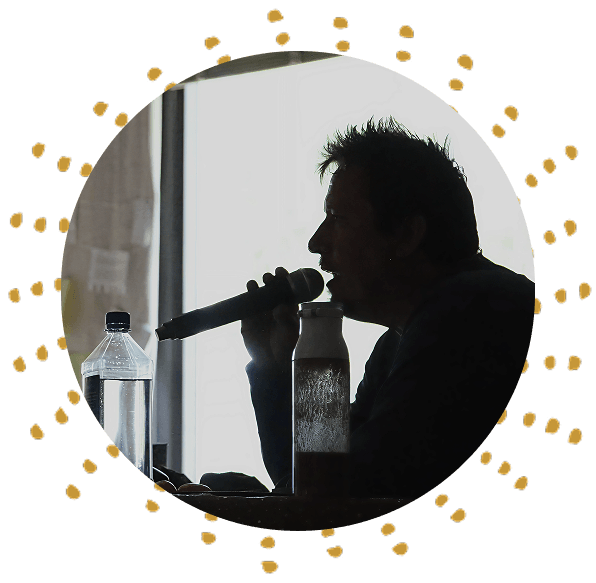 Jonathan Horan speaking into a microphone